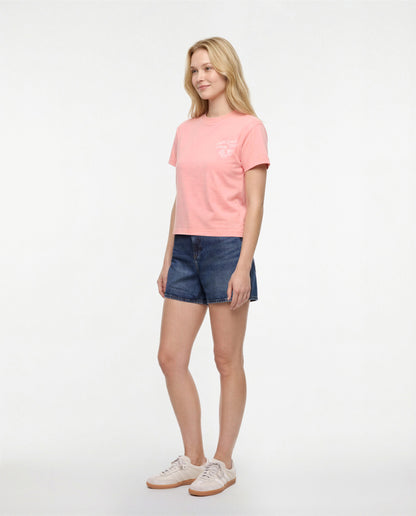 Side view of woman wearing a pale pink/red t-shirt with white &
