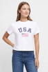 Front view of woman wearing a white t-shirt with &