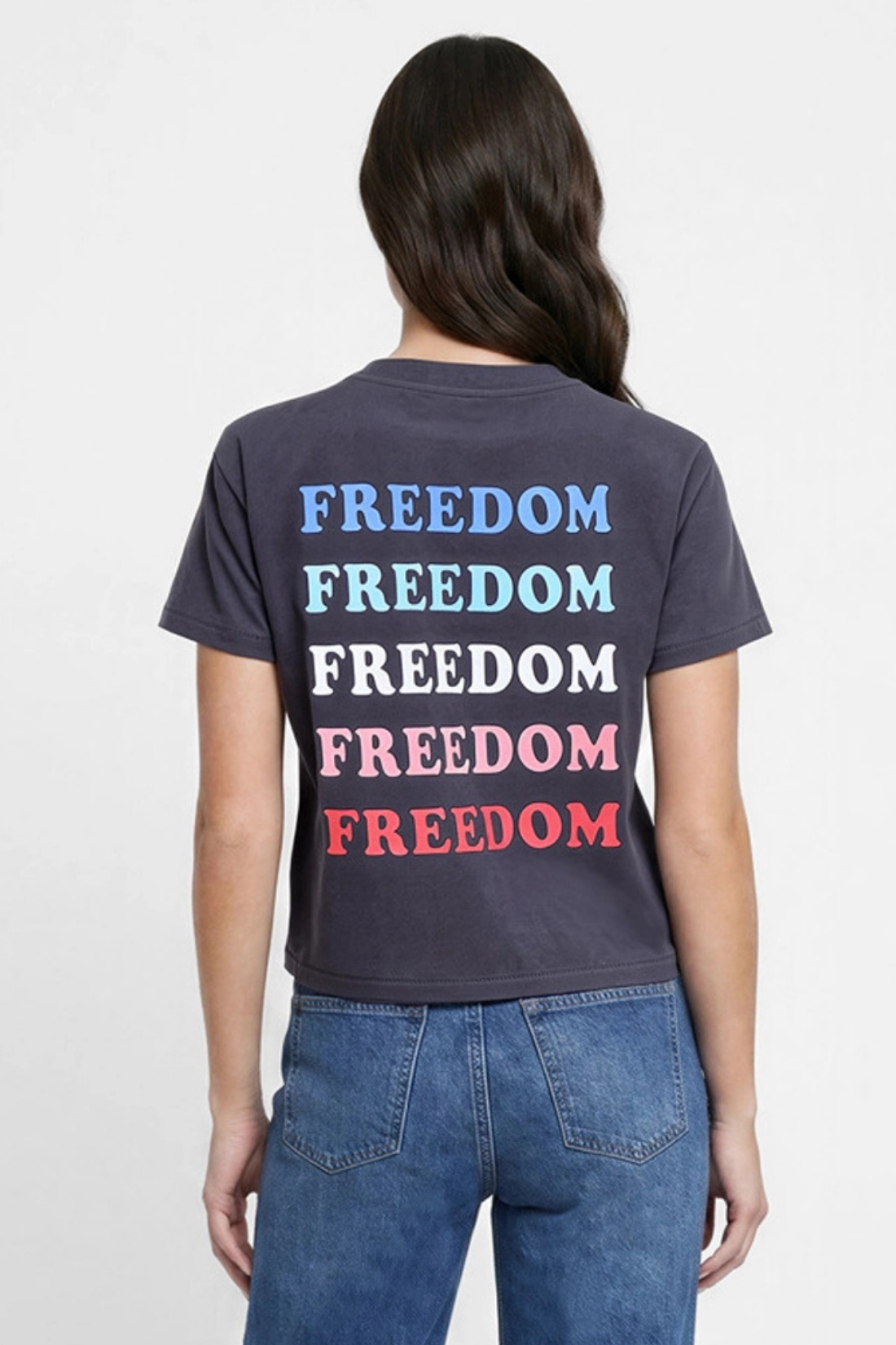 Back view of woman wearing a black t-shirt with &