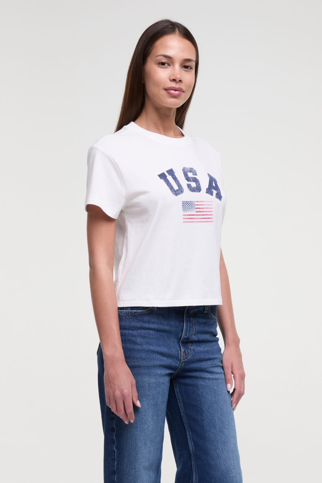 Front view of woman wearing a white t-shirt with &
