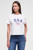 Front view of woman wearing a white t-shirt with &