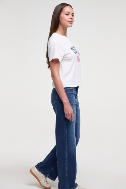 Side view of woman wearing a white t-shirt with &