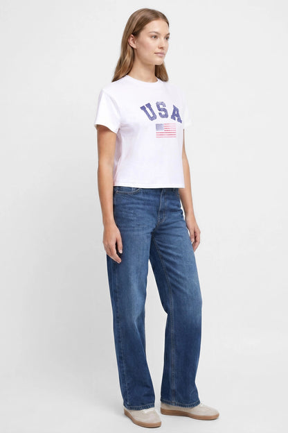 Front view of woman wearing a white t-shirt with &
