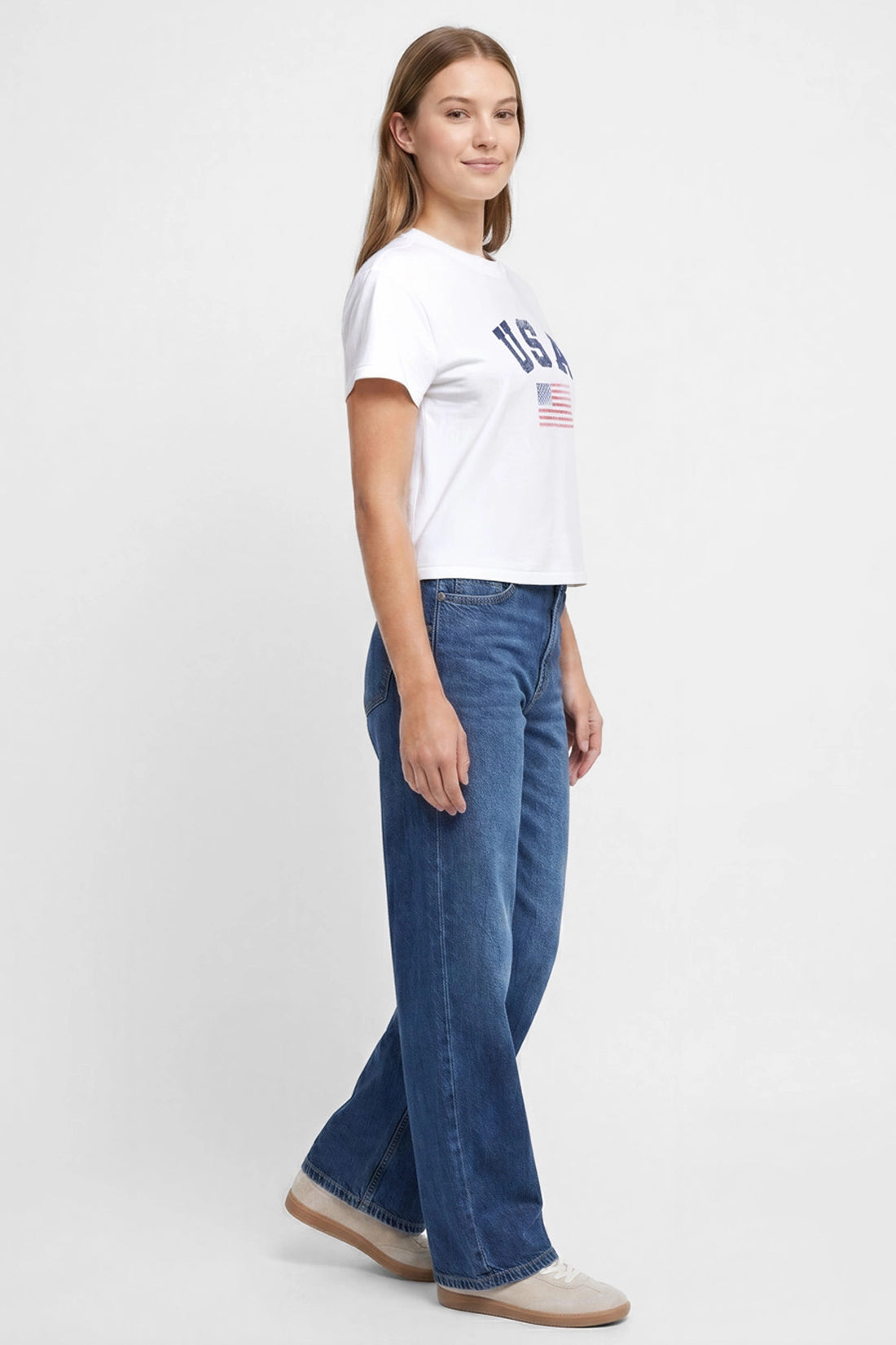 Side view of woman wearing a white t-shirt with &
