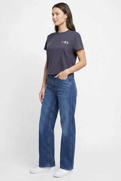 Front view of woman wearing a dark gray t-shirt with &