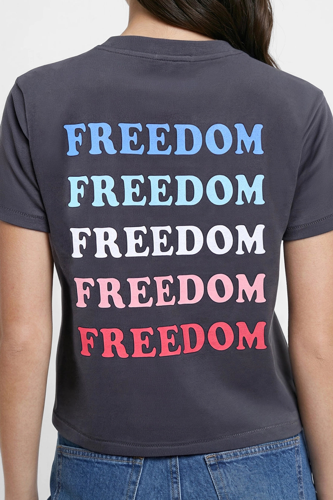 Close up back view of woman wearing a black t-shirt with &