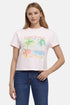 Woman wearing a pink t-shirt with a beach graphic and &