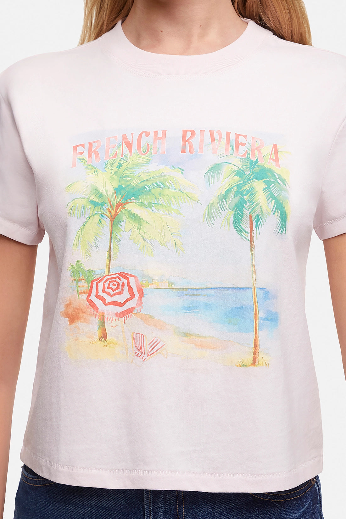 Close up of T-shirt with a beach graphic and &