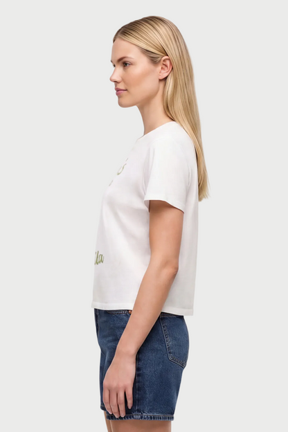 Side view of woman wearing a white t-shirt with a tequila cocktail glass graphic design and "Tuesday&