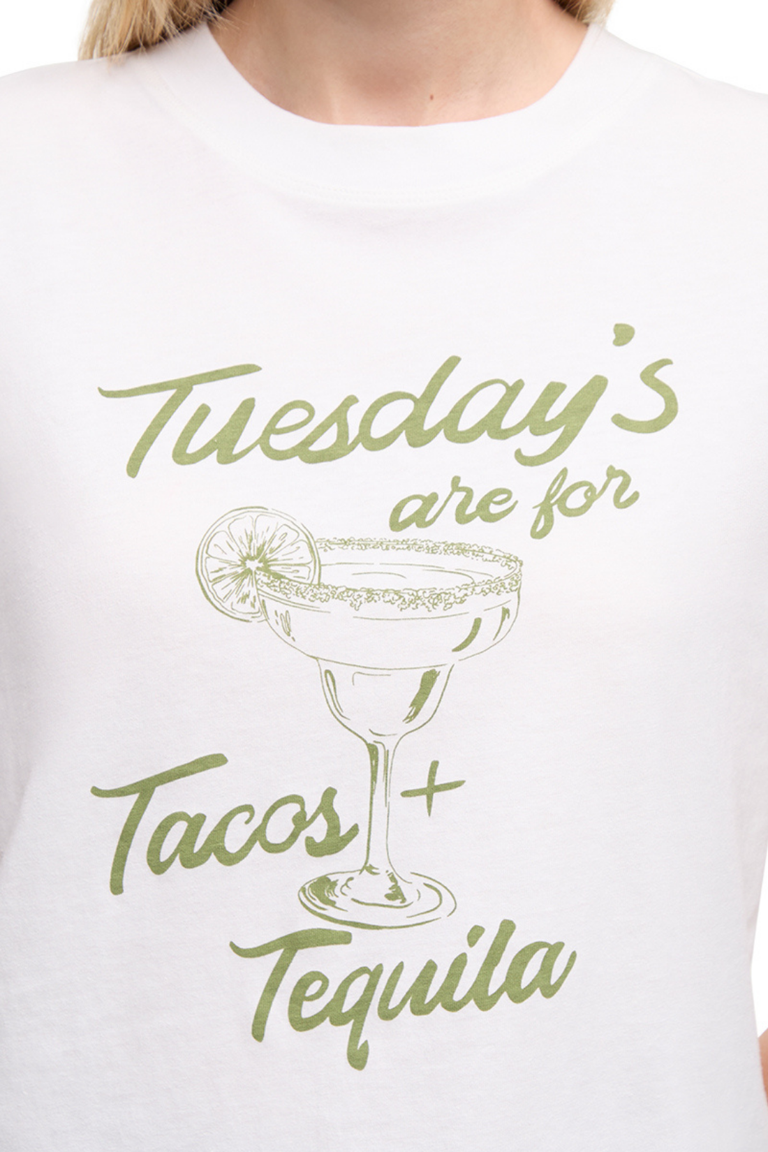 Close up view of woman wearing a white t-shirt with a tequila cocktail glass graphic design and "Tuesday&