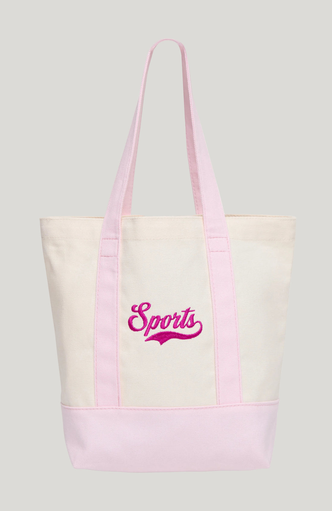 An off-white canvas tote bag with light pink handles and bottom trim, featuring the word &