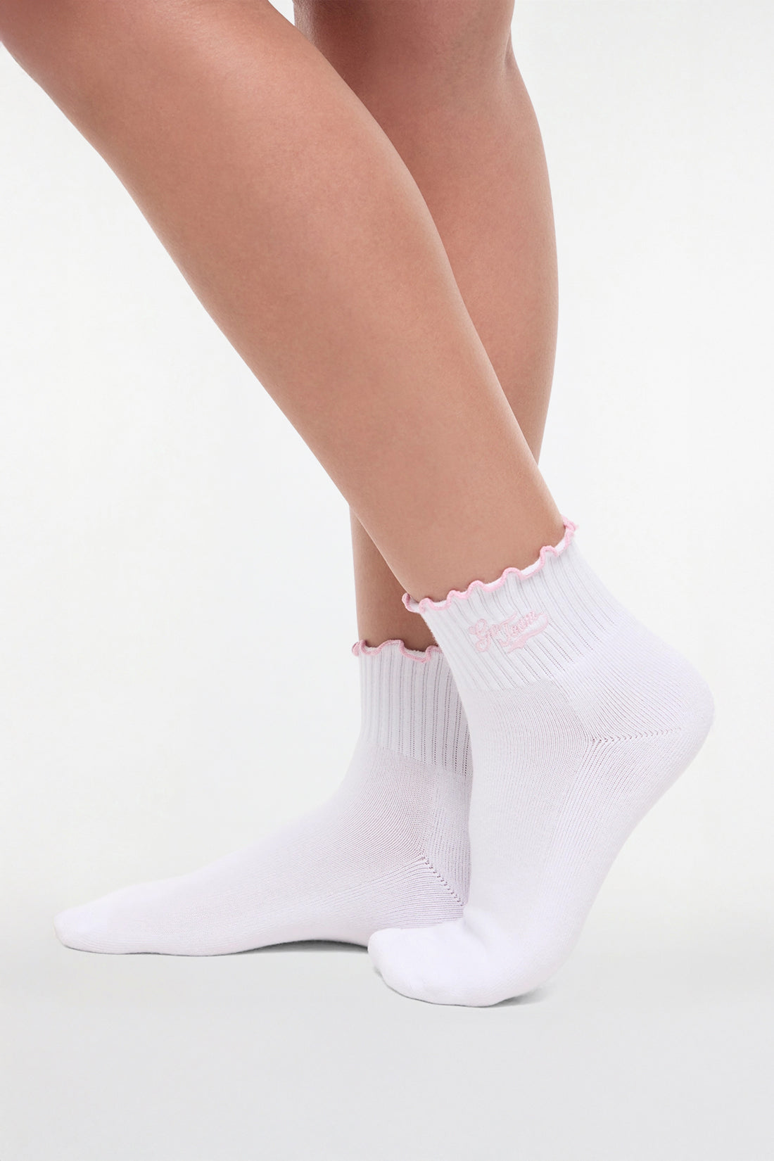 Side view of white socks with lilac trim and &