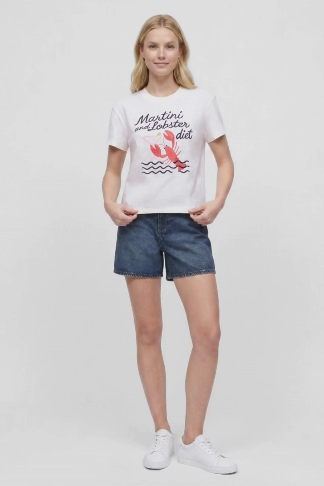 Video view of woman wearing a white t-shirt with &