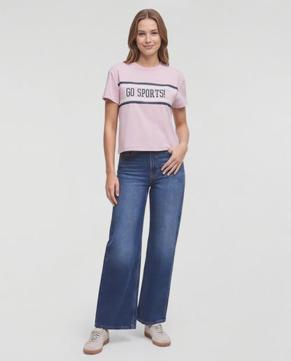 Video of a woman modeling a light pink short-sleeve t-shirt with &