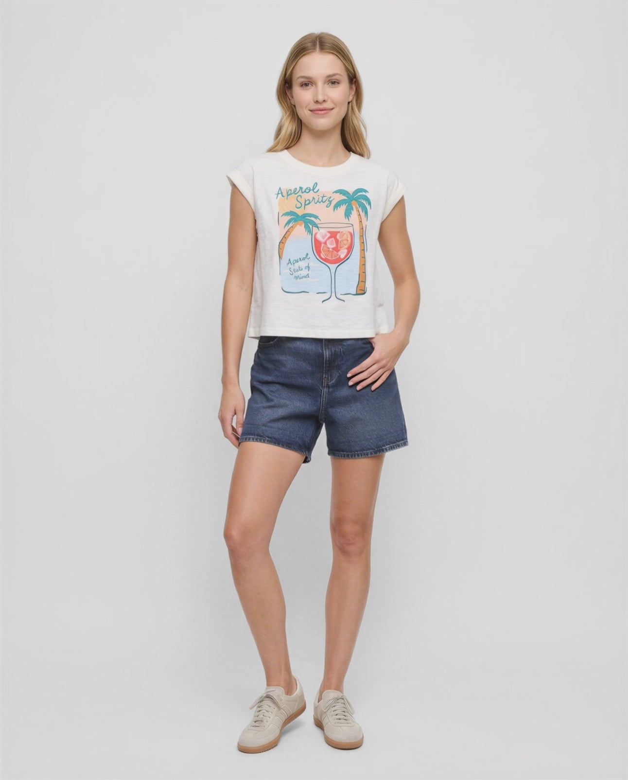 Video view of white t-shirt with "Aperol Spritz; Aperol State of Mind" text and graphic design featuring a cocktail and palm trees  on a white background. 