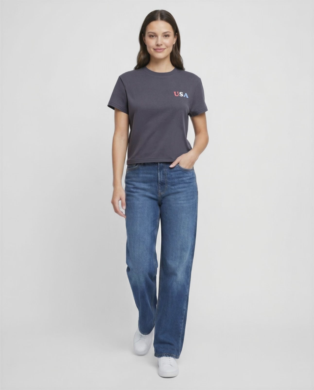Video view of woman wearing a dark gray t-shirt with &