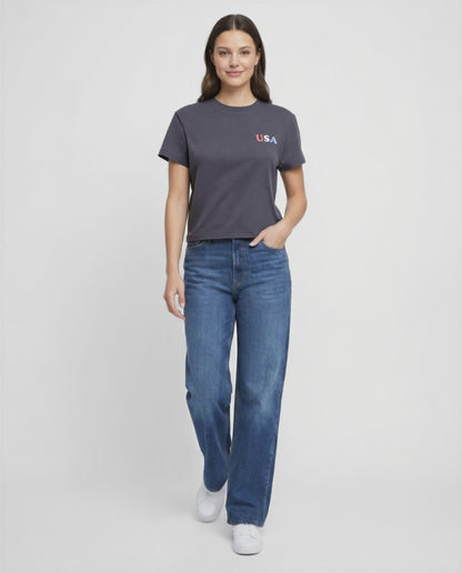 Video view of woman wearing a dark gray t-shirt with &